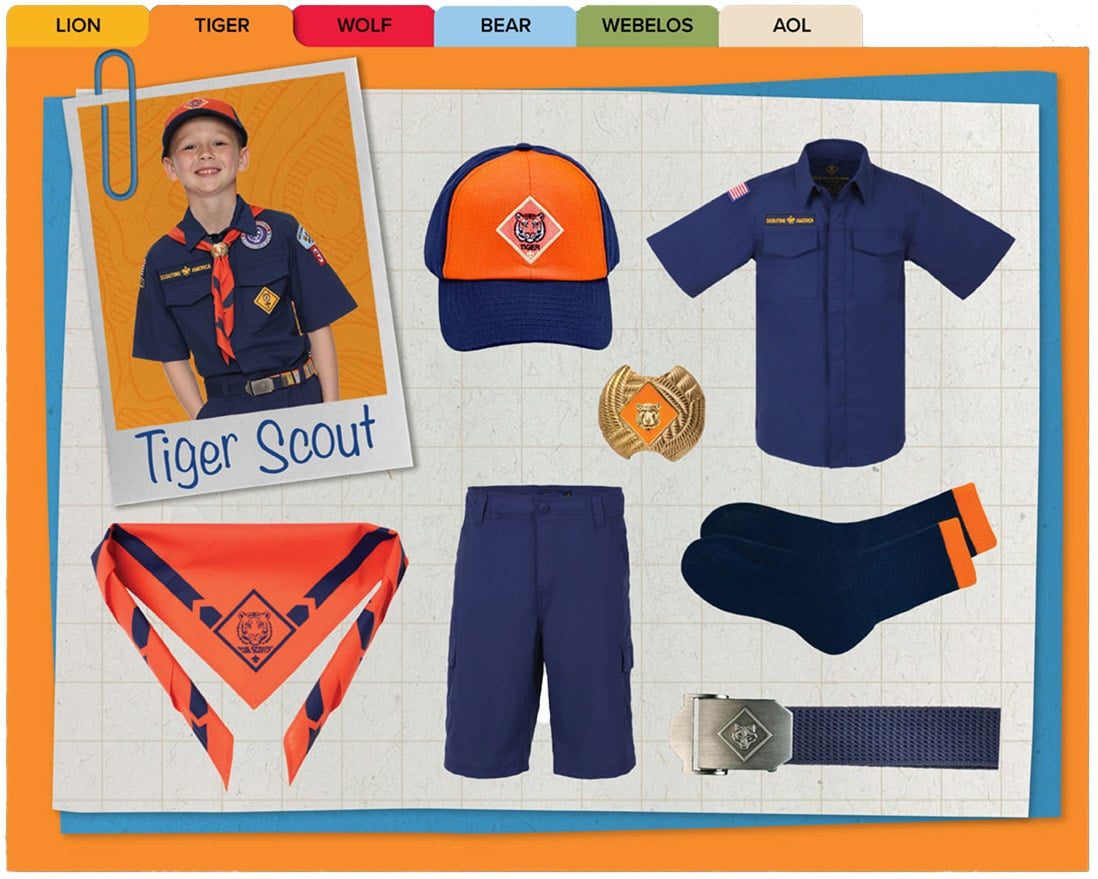 Official Tiger uniform: navy button shirt, orange-front cap, blue shorts, belt, socks, and the orange Tiger neckerchief.