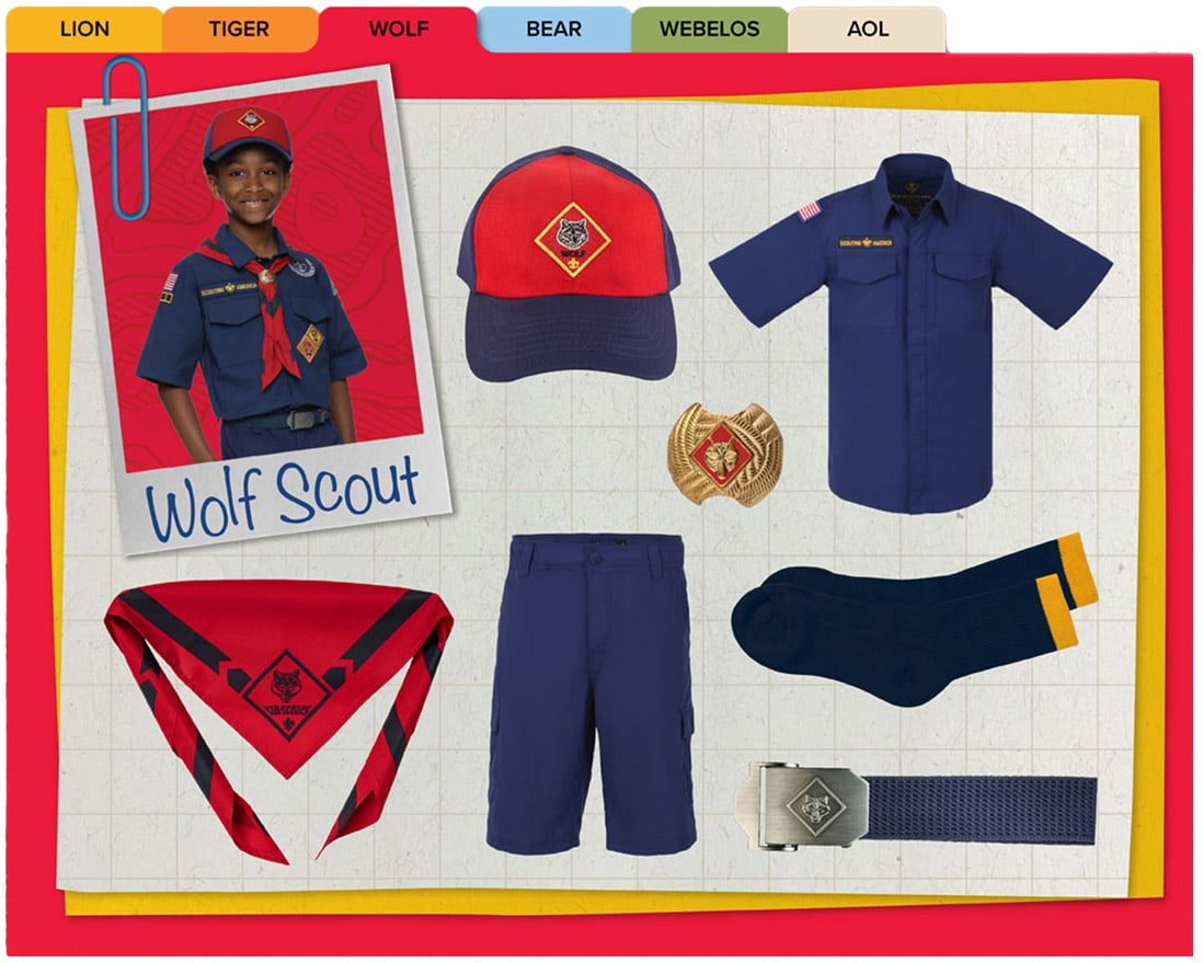 Official Wolf uniform: navy button shirt, red-front cap, blue shorts, belt, socks, and the red Wolf neckerchief.